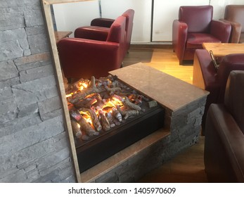Dubai UAE May 2019 - Artificial electronic fireplace in a coffee shop. Close-up of electrical fireplace in room. - Shutterstock ID 1405970609