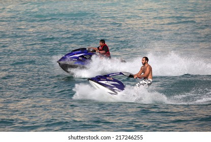 DUBAI, UAE - MAY 29: Young Arab Men Having Fun Riding Jetski In Dubai. May 29, 2010 In Dubai, United Arab Emirates 