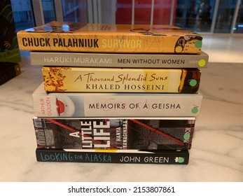 Dubai, UAE - May 3, 2022: Book Pile From Second Hand Book Store. Pile Of Treasure Found.