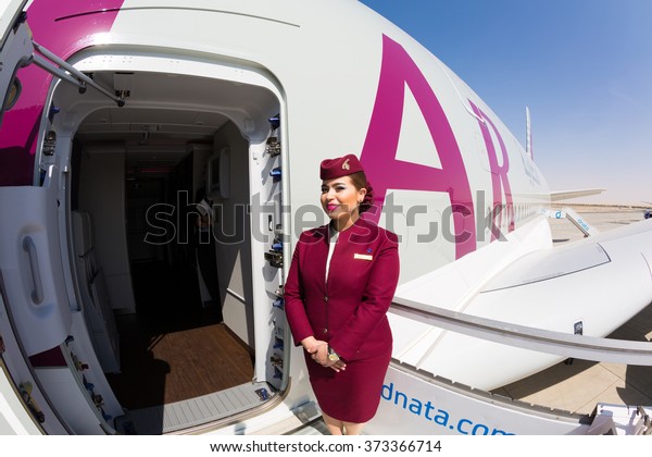 Dubai,\
UAE - NOVEMBER 10, 2015: Qatar Airways Airbus A380 cabin crew\
member, flight attendant. Qatar Airways Welcome aboard. Airbus\
A380. Travel with Qatar Airways. Stewardess\
dress.