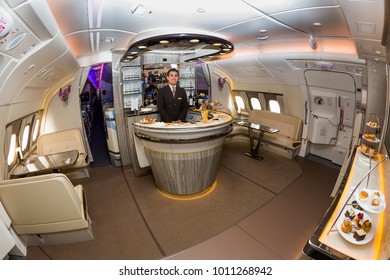 Dubai, UAE - NOVEMBER 12, 2017: Emirates Airbus A380 On Board Lounge And Bar. New Renewed Emirates Onboard Lounge. Luxury Travel. First Class Business Class Lounge. Flight Attendant,cabin Crew Member.