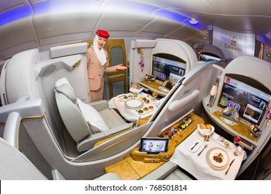 Dubai, UAE - NOVEMBER 12, 2017: Emirates Airline Flight Attendant. Emirates First Class. Onboard Food, Dining. Luxury Travel. Airbus A380. First Class Suite.