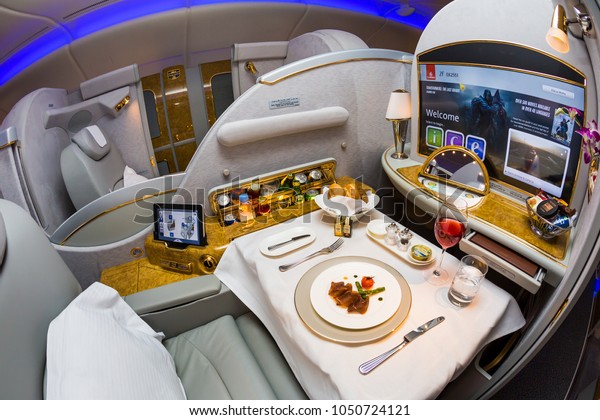 Dubai, UAE - NOVEMBER 12,\
2017: Emirates first class travel. Airbus A380. Exploring the world\
with Emirates. Luxury first class suite. Luxury travel. Business\
class travel.