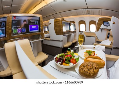 Dubai, UAE - NOVEMBER 14, 2017: Onboard Dining, Food. Airline Catering. Emirates New Business Class. Emirates Luxury Travel. Boeing 777. Renewed Business Class Cabin. Inflight Entertainment System IFE