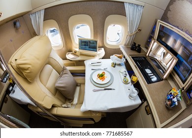 Dubai, UAE - NOVEMBER 14, 2017: Emirates New First Class Suite. Emirates Luxury Travel. Boeing 777. Onboard Dining, Food. Renewed First Class Cabin. Brand New Design. First Class Seat.