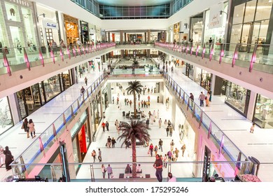 DUBAI, UAE - NOVEMBER 14: Shoppers at Dubai Mall on Nov 15, 2013 in Dubai. At over 12 million sq ft, it is the world's largest shopping mall