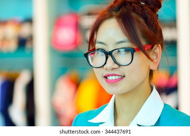 DUBAI, UAE - NOVEMBER 16, 2015: Close Up Portrait Of Seller In Dubai Duty Free. Dubai Duty Free Is The Largest Single Airport Retail Operation In The World