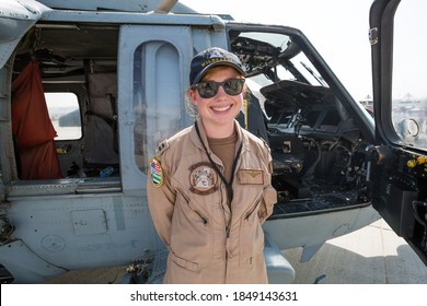 Dubai, UAE - NOVEMBER 16, 2017:  Portrait Of Female US Army Soldier Pilot Standing Near The Helicopter