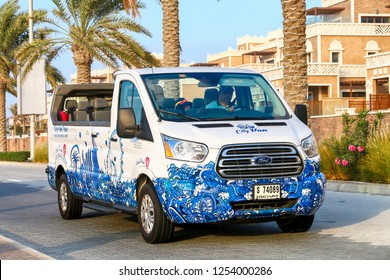 Dubai, UAE - November 18, 2018: Touristic Convertible Van Ford Transit In The City Street.