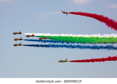 Dubai, UAE - November 18, 2019: Aerobatics Team Al Fursan Performing Airshow With Color Smokes. Air Show. Aerobatics Team. Display Team.