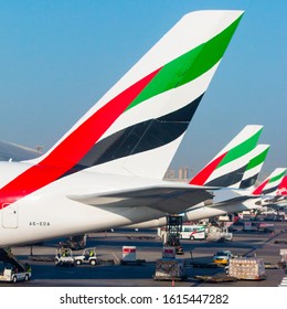 DUBAI, UAE - NOVEMBER 20, 2019: Aircraft Rudders With Emirates Airlines Sign In Early Morning On Dubai International Airport. It Is An Major Airline Hub In The Middle East. 