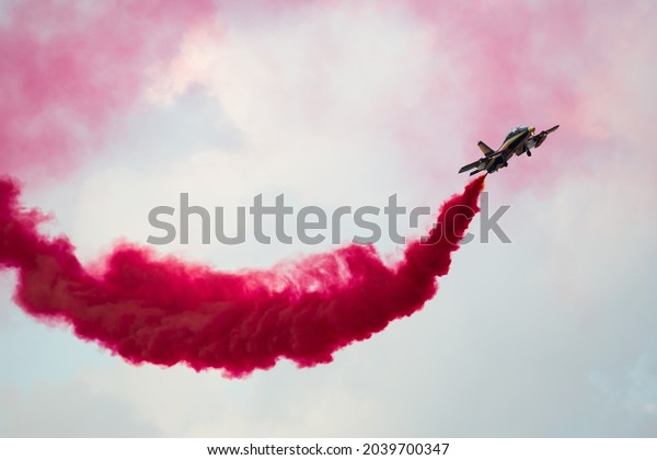 Dubai, UAE - November 21, 2019: Aerobatics team Al\
Fursan performing airshow with color smokes. Air show. Aerobatics\
team. Display team.