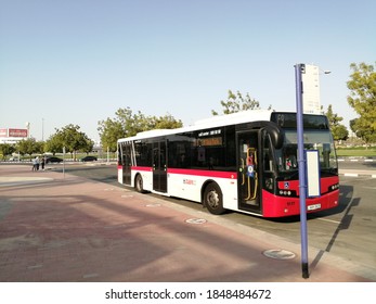 Dubai, UAE - November 6, 2020: Public transport bus of Dubai's Roads & Transport Authority (RTA) at a bus stop in the cosmopolitan city, where private car ownership is among the highest in the world.
