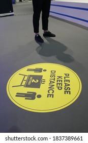 Dubai, UAE - October 10, 2020: Decal/sticker Sign Instructs Visitors To Maintain Social Distance As A Stipulated Health Precaution At 'World Art Dubai' Retail Art Fair, During The Covid-19 Pandemic.