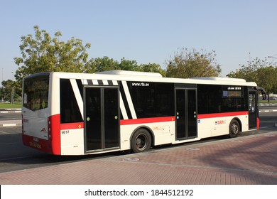 Dubai, UAE - October 31, 2020: Public transport bus of Dubai's Roads & Transport Authority (RTA) at a bus stop in the cosmopolitan city, where private car ownership is among the highest in the world.
