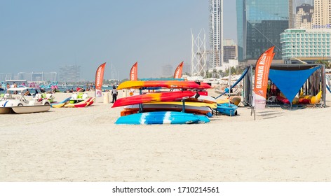 Dubai, UAE - October 5, 2019 - Entertainment On The Public Beach Of Marina, Dubai, UAE. Parasailing, Banana Ride, Water Slides, Trampoline