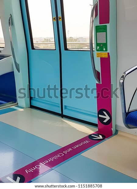 DUBAI, UAE - September, 2017:\
Wagon parting line for women. Separation line for female part car.\
Empty wagon subway inside. Metro line interior in Dubai, UAE.\
