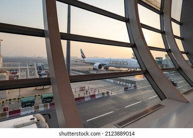 Dubai, UAE - September 2021: Emirates Airlines aircraft in Dubai Airport, UAE. Emirates is an airline based in Dubai, UAE, and the largest airline in Middle East.	
