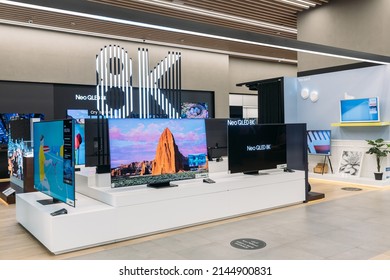 Dubai, UAE, United Arab Emirates - May 28, 2021: View of 8K TVs in samsung store. Modern TVs in the Samsung brand store. TVs in the Samsung brand in modern shopping mall centre.