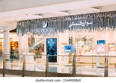 Dubai, UAE, United Arab Emirates - May 28, 2021: View of logotype logo sign Swarovski at wall of store. The Swarovski Crystal Business, which primarily produces crystal glass, jewelry and accessories.