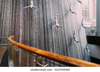 Dubai, UAE, United Arab Emirates - May 22, 2021: View Of Waterfall With Figures Of Divers In The Dubai Mall. Fountain In The Dubai Shopping Mall Pearl Divers, Pearl Diver. Landmark Of Downtown In