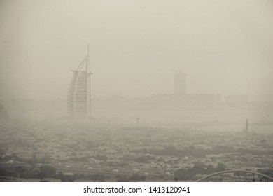 Dubai, UAE-May 9, 2019 ; The Black And White World's First Seven Stars Luxury Hotel Burj Al Arab In The Mist During Sunset.