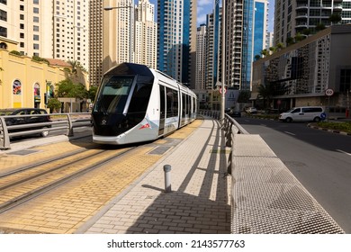 Dubai, UAEmirates - april 7 2022: Image of the modern Dubai Marina Tram operated by RTA company of Dubai with route between Marina Jumeirah Towers and Al Safouh station.
