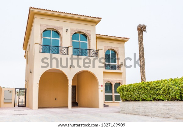 Dubai / United Arab Emirates -\
02-27-2019 : state of the art, big yellow villa house in dubai, in\
the villa project Dubai. Private covered car parking also\
avaialbe