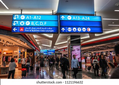 Dubai, United Arab Emirates - April 11 2018: Passengers are walking to departure gates in Dubai International Airport (DXB)