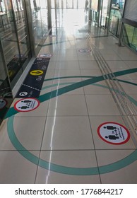 Dubai, United Arab Emirates- April 30, 2020: Awareness Stickers On The Floor Inside Dubai Metro Train, Requesting Passengers, Arabic Means: Keep Safe Distance Distance