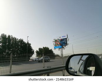 Dubai, United Arab Emirates - April 22, 2022: V-shaped Digital Screen Outdoor Advertising Billboard (hoarding, Scaffolding). Digital Screen Out Of Home Advertising Concept.