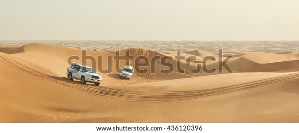 DUBAI, UNITED\
ARAB EMIRATES - APRIL 20, 2016: Safari Toyota rally off-road car\
4x4 adventure driving Toyota in the desert sand dune is a popular\
activity among tourists in\
Dubai.