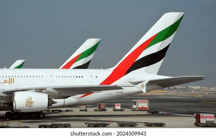 DUBAI, UNITED ARAB EMIRATES - Dec 01, 2015: A closeup shot of a  side view of Emirates Airlines aircraft parked on the stand at Dubai Airport