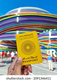 Dubai, United Arab Emirates- December 2, 2021: Male Tourist Hand Holding Expo 2020 Passport In The Front Of Russia Pavilion At EXPO 2020 Dubai. Being Held From October 1, 2021 To March 31, 2022