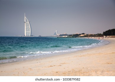 DUBAI, UNITED ARAB EMIRATES - FEBRUARY 2018 : Burj Al Arab, One Of The Most Famous Landmarks Of United Arab Emirates Seen From Black Palace Public Beach.