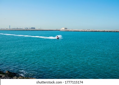 Dubai, United Arab Emirates January 16, 2020: Man Riding Jet Ski In In Persian Gulf, Dubai. Tourist Enjoy Driving Jetski On The Ocean.