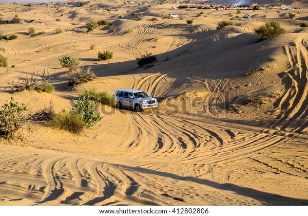 DUBAI,\
UNITED ARAB EMIRATES - JANUARY 25, 2016: Safari Toyota rally\
off-road car 4x4 adventure driving Toyota in the desert sand dune\
is a popular activity among tourists in\
Dubai.