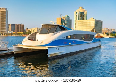 Dubai, United Arab Emirates- JULY 30, 2020: Dubai ferry water public transportation docked at Al Seef Marina View, opposite of old dubai deira in Arabian Heritage village, Al Seef Dubai