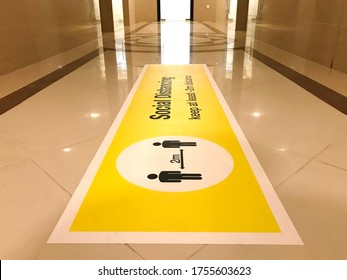 DUBAI / UNITED ARAB EMIRATES - JUNE 2020: Social Distancing Stickers On The Floor Of An Official Building In JLT. Social Distancing Sign. COVID-19 Prevention. Office Building.