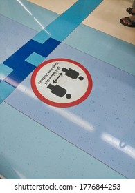 Dubai, United Arab Emirates- June 5, 2020: Awareness Stickers On The Floor Inside Dubai Metro Train, Requesting Passengers, Arabic Means: Keep Safe Distance Distance