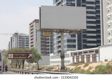 Dubai, United Arab Emirates - March 7, 2022: Large Outdoor Advertising Display (unipole Billboard) Located On A Major Highway In Dubai City. Out Of Home Advertising Concept.