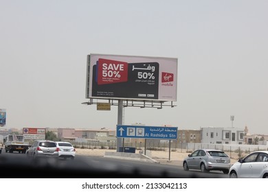 Dubai, United Arab Emirates - March 7, 2022: Large Outdoor Advertising Display (unipole Billboard) Located On A Major Highway In Dubai City. Out Of Home Advertising Concept.