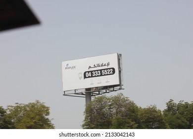 Dubai, United Arab Emirates - March 7, 2022: Large Outdoor Advertising Display (unipole Billboard) Located On A Major Highway In Dubai City. Out Of Home Advertising Concept.