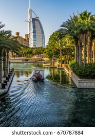 DUBAI, UNITED ARAB EMIRATES - MAY 6, 2014: View of the famous luxury hotel Burj Al Arab from the artificial river. 