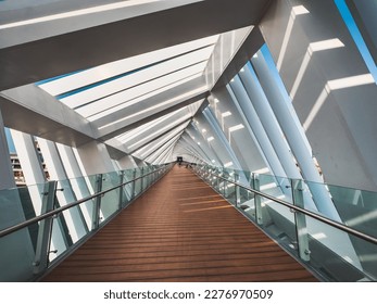 Dubai Water Canal Helix Bridge, pedestrian bridge with water taxi, in Dubai, UAE - Powered by Shutterstock