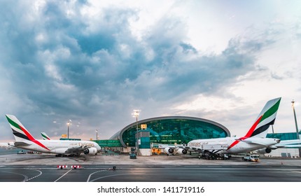 Dubai/UAE - April 10th 2019: Terminal 3 with airplane and cloudy sky