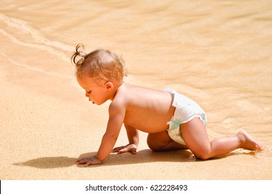 DUBAI,UAE - MARCH 12, 2012:Little Baby In Diaper Crawl In The Pool At Jumeirah Beach HotelDubai.