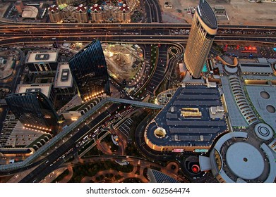 DUBAI/UAE - NOV 22, 2015: View over the amazing Dubai by night from the skyscraper Burj Khalifa. The Mall is clearly visible.