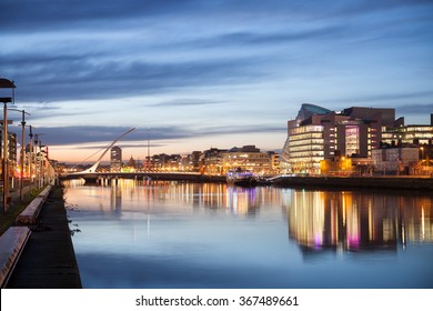 Dublin City Center during sunset with Samuel Beckett Bridge and river Liffey