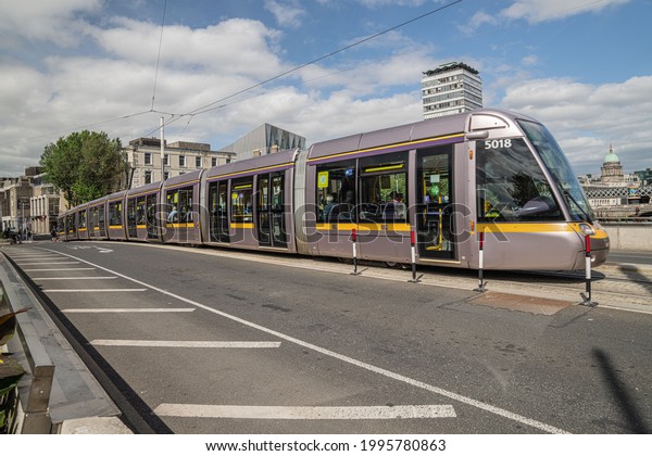 Dublin\
City, Dublin, Ireland, June 11th 2021. Luas crossing the Rosie\
Hackett Bridge from north to south side of\
Dublin
